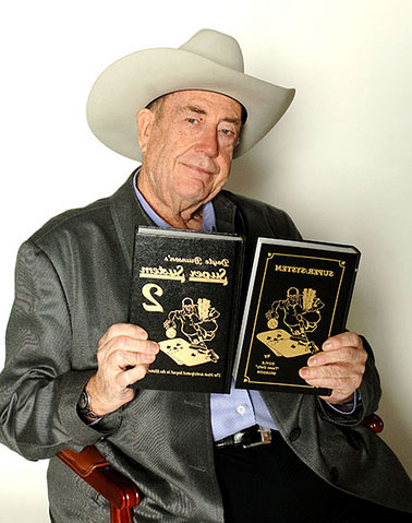Doyle Brunson and his two seminal strategy books on poker: Super System and Super System 2.
