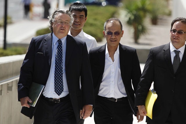 Paul Phua and his son Darren with their lawyers during trial in Las Vegas (source: scmp.com)